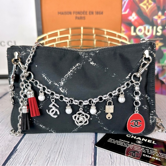 CHANEL black nylon pouch crossbody with chain, bag charm and authenticit⦠- Picture 1 of 12